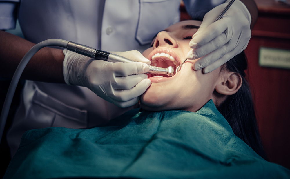A dental patient undergoing implant procedure, in dental chair.