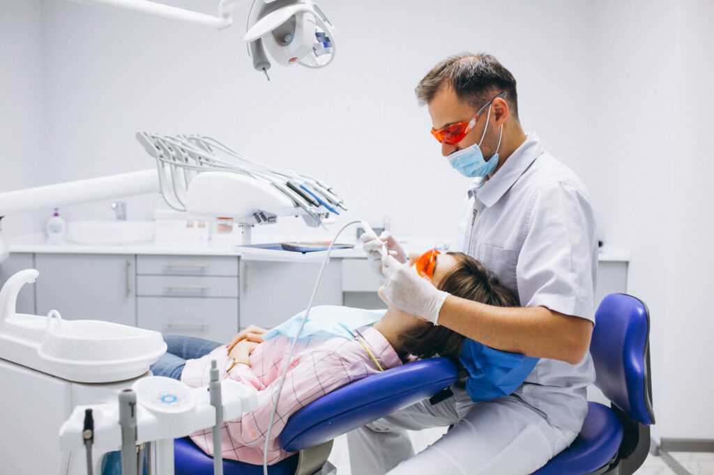 A dentist performing a procedure on a patient